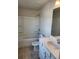 Well-lit bathroom with a shower-tub combo and a vanity featuring a white countertop at 3765 Davis Cir, Duluth, GA 30096