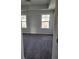 Carpeted bedroom featuring two windows and neutral walls at 3765 Davis Cir, Duluth, GA 30096