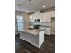 Modern kitchen with granite counters, stainless appliances, and white cabinets at 3765 Davis Cir, Duluth, GA 30096