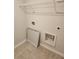 Tiled laundry room including wire rack shelf, and washer/dryer hookups at 3765 Davis Cir, Duluth, GA 30096
