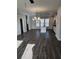 Open-concept living space with dark floors, island kitchen, and large windows providing natural light at 3765 Davis Cir, Duluth, GA 30096