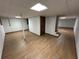Basement rec room with wood-look floors, bright recessed lighting, and a separate room at 690 Antioch Rd, Powder Springs, GA 30127