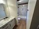 Well-lit bathroom showcasing a marble tiled shower with a white vanity at 690 Antioch Rd, Powder Springs, GA 30127