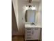Charming bathroom featuring a marble countertop, a white vanity, and modern fixtures at 690 Antioch Rd, Powder Springs, GA 30127
