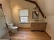 Bathroom featuring a modern vanity, toilet and a scenic window view at 690 Antioch Rd, Powder Springs, GA 30127