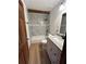 Modern bathroom featuring a marble-tiled shower and granite vanity at 690 Antioch Rd, Powder Springs, GA 30127