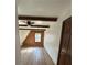 Cozy bedroom with wood paneling and beamed ceilings at 690 Antioch Rd, Powder Springs, GA 30127