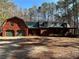 Charming log cabin home with a metal roof, attached garage, and a welcoming front porch at 690 Antioch Rd, Powder Springs, GA 30127