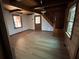 Cozy living room with a hardwood floor and wooden staircase at 690 Antioch Rd, Powder Springs, GA 30127