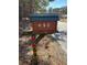 Unique log-style mailbox featuring the house number 690 on a wooden post at 690 Antioch Rd, Powder Springs, GA 30127