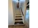 Staircase featuring dark wood treads and white risers at 690 Antioch Rd, Powder Springs, GA 30127