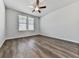 This bedroom has laminate floors and a ceiling fan at 3614 Arrow Root Cir, Loganville, GA 30052