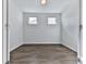Empty bedroom with lots of natural light and wood-look floors at 3614 Arrow Root Cir, Loganville, GA 30052