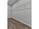 This walk-in closet has laminate floors and wire shelving at 3614 Arrow Root Cir, Loganville, GA 30052