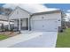 Charming single-story home with a two-car garage and professionally landscaped front yard at 3614 Arrow Root Cir, Loganville, GA 30052