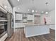 Kitchen with granite countertops, stainless steel appliances, and a breakfast bar island at 3614 Arrow Root Cir, Loganville, GA 30052