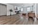 Bright and airy living room with hardwood floors, fireplace, and large windows at 3614 Arrow Root Cir, Loganville, GA 30052