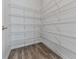 Walk-in pantry with ample shelving for organized storage at 3614 Arrow Root Cir, Loganville, GA 30052