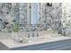 Charming bathroom with floral wallpaper, stylish fixtures, and a marble countertop showcase elegance at 2525 Peachtree Ne Rd # 25, Atlanta, GA 30305