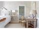 Charming bedroom featuring floral wallpaper, a white bed, and an antique desk at 2525 Peachtree Ne Rd # 25, Atlanta, GA 30305