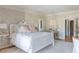 Elegant bedroom with a white bed frame, patterned wallpaper, and hardwood floors at 2525 Peachtree Ne Rd # 25, Atlanta, GA 30305