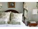Inviting bedroom with floral pillows, and a dark wood nightstand at 2525 Peachtree Ne Rd # 25, Atlanta, GA 30305