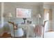 Cozy dining area with floral wallpaper, round table, and comfortable chairs at 2525 Peachtree Ne Rd # 25, Atlanta, GA 30305
