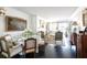 Open concept dining room featuring a glass table, hardwood floors, and natural lighting at 2525 Peachtree Ne Rd # 25, Atlanta, GA 30305