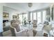 Bright living room featuring plush seating, elegant decor, and natural light from large windows at 2525 Peachtree Ne Rd # 25, Atlanta, GA 30305