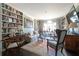 Cozy living room with floor to ceiling bookshelves, fireplace, and large windows offer a comfortable space at 2525 Peachtree Ne Rd # 25, Atlanta, GA 30305