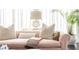 Elegant living room detail with natural light, plush pillows, and a modern lamp at 2525 Peachtree Ne Rd # 25, Atlanta, GA 30305
