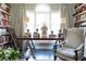 Well-lit living room featuring bookshelves and neutral toned decor at 2525 Peachtree Ne Rd # 25, Atlanta, GA 30305