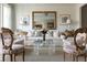 Cozy living area with a decorative mirror, comfortable seating, and a clear coffee table centerpiece at 2525 Peachtree Ne Rd # 25, Atlanta, GA 30305