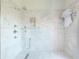 Contemporary walk-in shower with marble tiling, dual shower heads, and built-in niche at 2525 Peachtree Ne Rd # 25, Atlanta, GA 30305