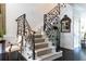 Beautiful staircase with unique iron railings and patterned carpet, enhancing the home's character at 2525 Peachtree Ne Rd # 25, Atlanta, GA 30305