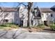 A row of townhomes shows off manicured landscaping, neutral color palettes, and unique architectural features at 2525 Peachtree Ne Rd # 25, Atlanta, GA 30305