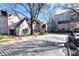 Street view features charming townhomes, mature trees, and a quaint brick road at 2525 Peachtree Ne Rd # 25, Atlanta, GA 30305