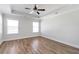 Spacious bedroom with hardwood floors, ceiling fan, and ample natural light at 2989 Chene Pl, Duluth, GA 30097