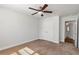 Bright bedroom with neutral carpet, closet, and ceiling fan offers comfortable living at 2989 Chene Pl, Duluth, GA 30097