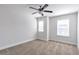 Bright bedroom with carpet, ceiling fan, and large windows at 2989 Chene Pl, Duluth, GA 30097