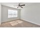 Bright bedroom featuring neutral carpet and large window for abundant natural light at 2989 Chene Pl, Duluth, GA 30097