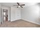 Bright bedroom features neutral carpet, ceiling fan, and closet for ample storage at 2989 Chene Pl, Duluth, GA 30097