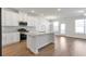 Open kitchen with granite countertops, stainless steel appliances, and ample cabinet space at 2989 Chene Pl, Duluth, GA 30097