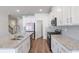 Well-equipped kitchen with granite countertops, stainless steel appliances, and hardwood floors at 2989 Chene Pl, Duluth, GA 30097