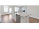 Open-concept kitchen with island, granite countertops, and stainless steel dishwasher at 2989 Chene Pl, Duluth, GA 30097