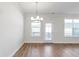 Bright living room featuring hardwood floors and a modern chandelier at 2989 Chene Pl, Duluth, GA 30097