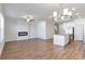 Open-concept living room featuring a modern fireplace and island with stainless appliances at 2989 Chene Pl, Duluth, GA 30097