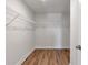 Walk-in closet with built in shelving and hardwood floors provides ample storage space at 2989 Chene Pl, Duluth, GA 30097