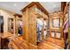 Custom closet features hardwood floors and an abundance of shelves and hanging storage space at 4001 Pool Rd, Winston, GA 30187