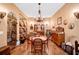 Elegant dining room has hardwood floors, wine storage, and traditional style furniture at 4001 Pool Rd, Winston, GA 30187